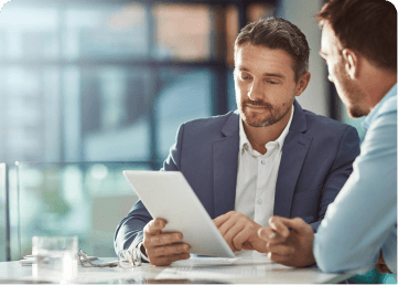 Hiring managers reviewing a talent pipeline on a tablet